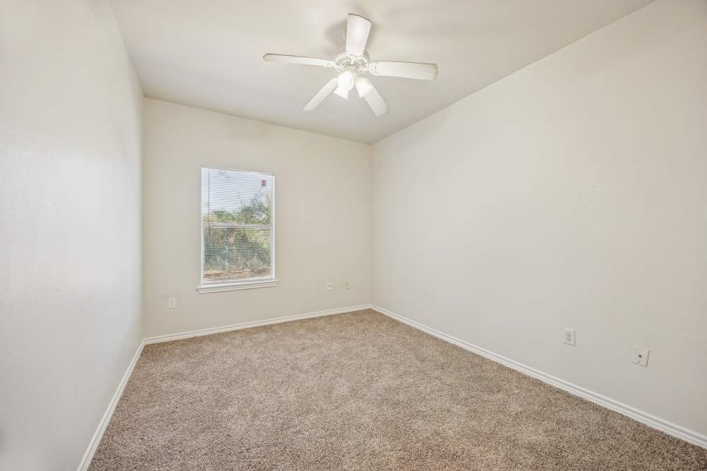 Bedroom with a ceiling fan at Casa Brazoria in Clute, Texas