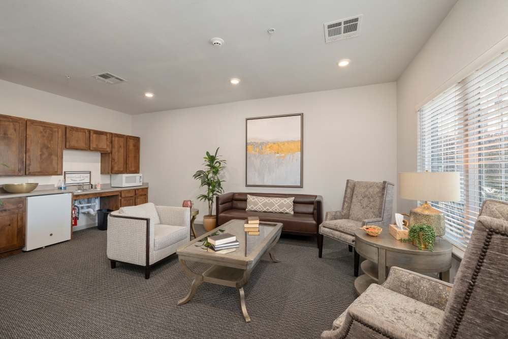 Living space and kitchen in the clubhouse at Villas At Lark Pointe in Springfield,Missouri