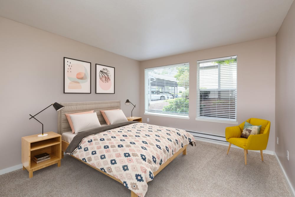 Master bedroom with a large window for natural lighting at Meadows at Cascade Park Apartments in Vancouver, Washington