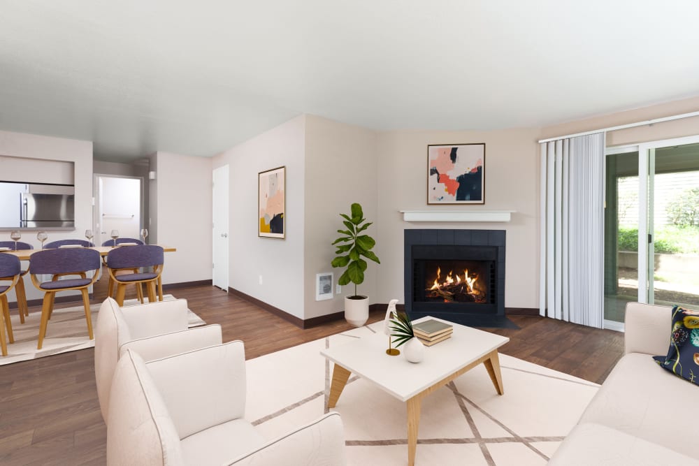 A living room complete with a fireplace at Meadows at Cascade Park Apartments in Vancouver, Washington