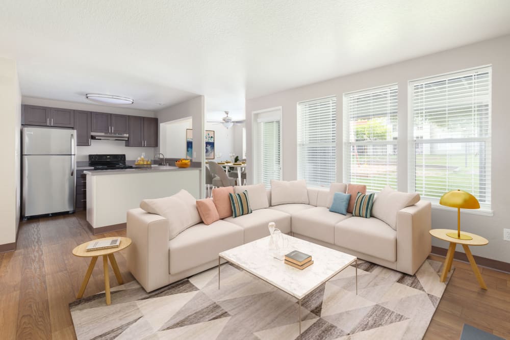 Lovely spacious living room and kitchen open floor plan at Meadows at Cascade Park Apartments in Vancouver, Washington