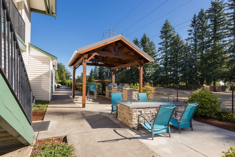 Lounge area with a fire pit at The Landings at Morrison Apartments in Gresham, Oregon