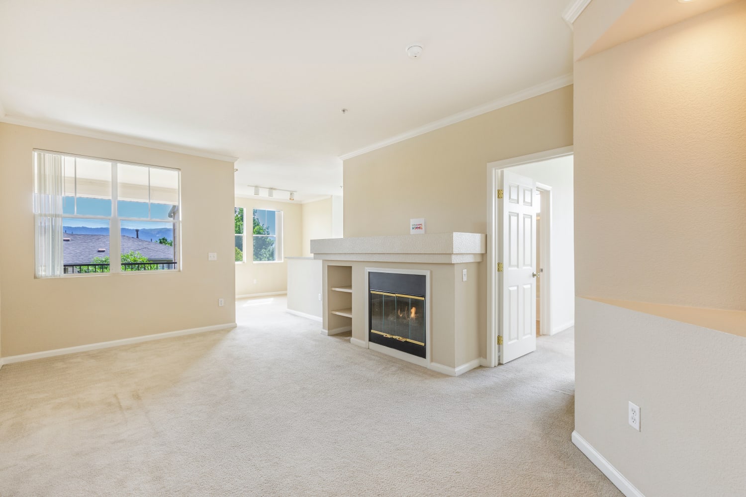 A fireplace in a beautiful open living room floor plan at Park Hacienda Apartments in Pleasanton, California