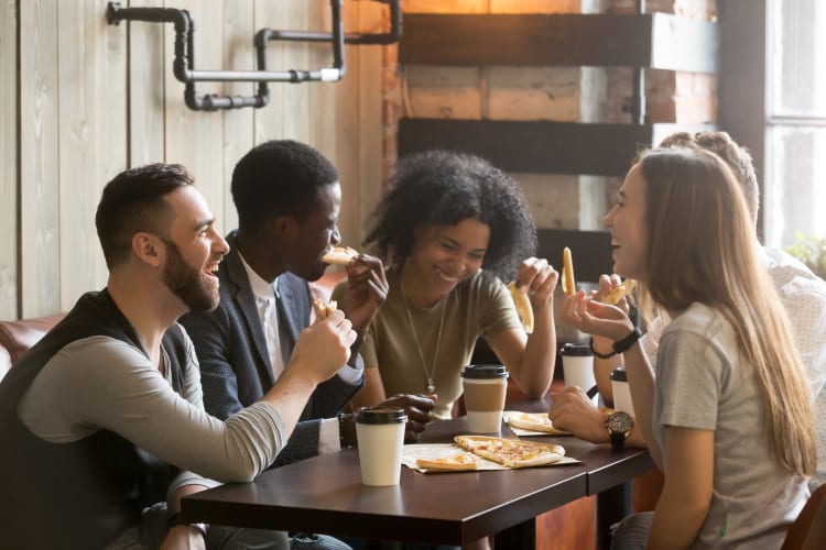 A group of residents enjoying food at a restaurant near South Meadow in Ames, Iowa.
