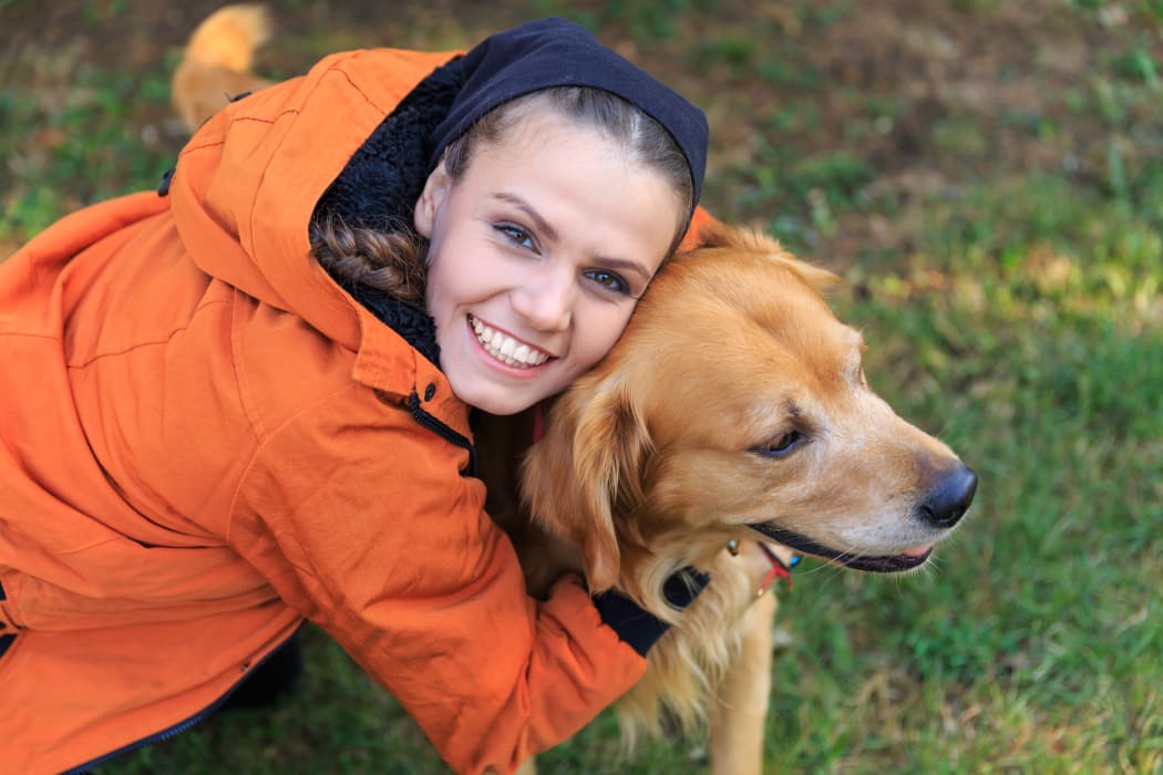 Resident and her dog at Chateau Woods Apartments