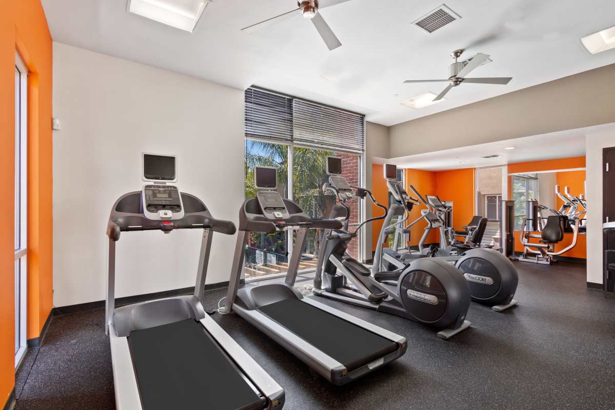 Fullty equipped fitness center at Ontario Town Square Townhomes in Ontario, California
