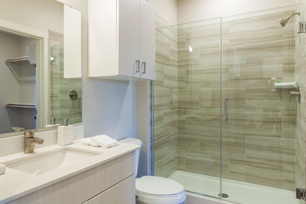 Luxurious bathroom with tub and shower in a model home at Capitol Flats in Santa Fe, New Mexico