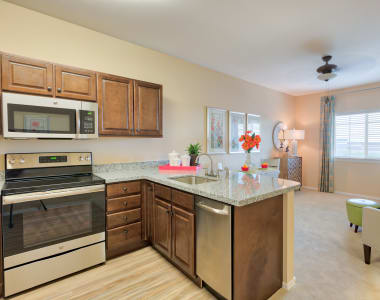 Kitchen and living area in model senior private cottage at Burr Ridge Senior Living