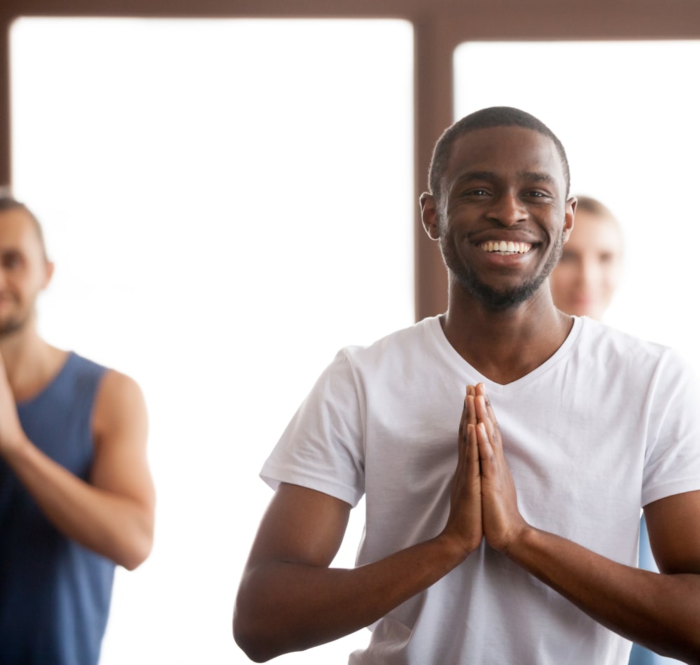 Residents enjoying yoga at Baltimore Station in Detroit, Michigan