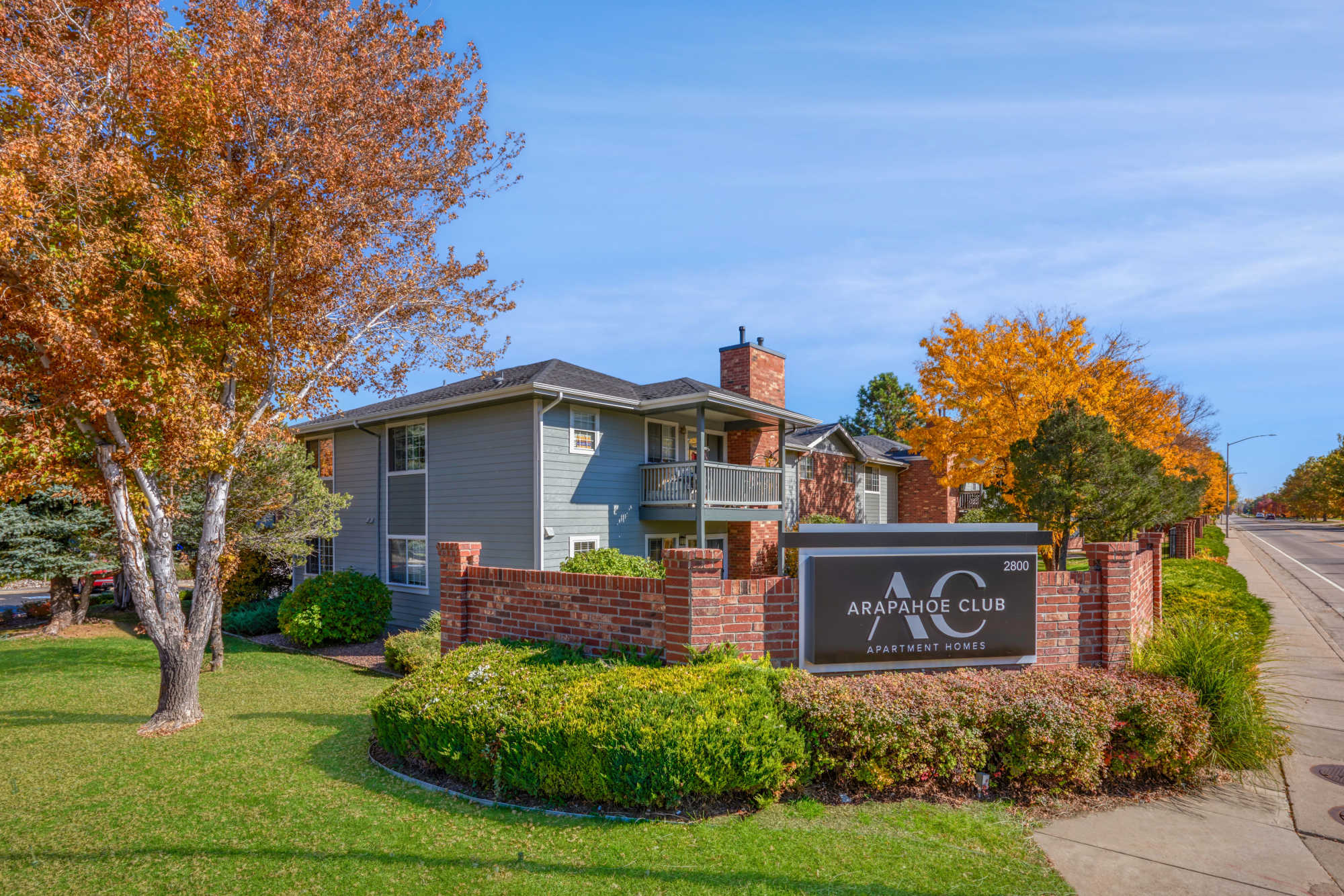 Property signage board at Arapahoe Club Apartments in Denver, Colorado