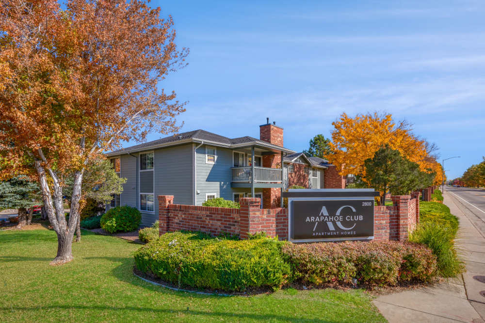 Property signage board at Arapahoe Club Apartments in Denver, Colorado