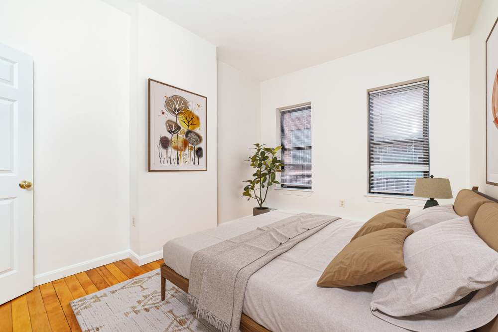 Garden style windows with blinds and a plant at 15-25 Hemenway Apartments in Boston, Massachusetts