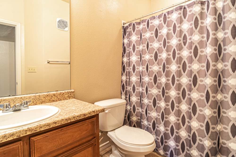 Bathroom with dual vanity sinks at Blue Ridge in Midland, Texas