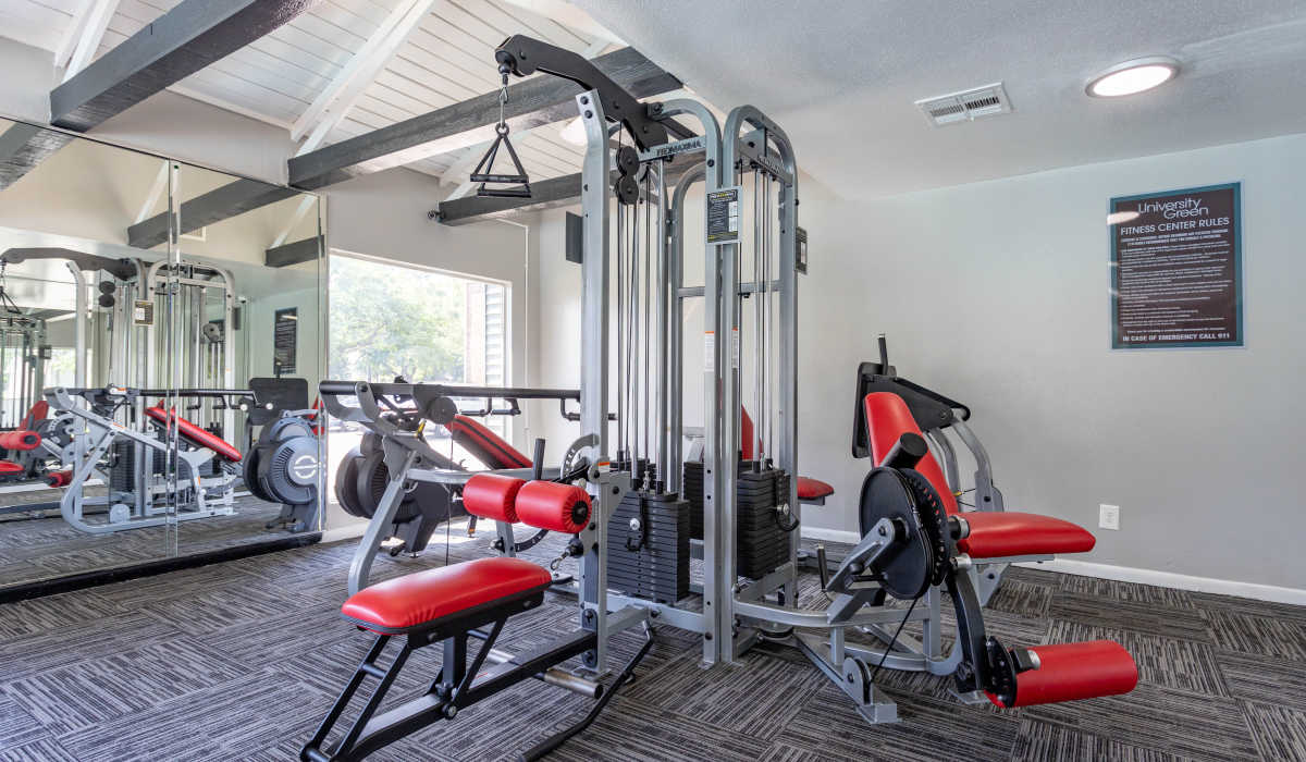 Strength training equipment of fitness center at University Green Apartments in Houston, Texas