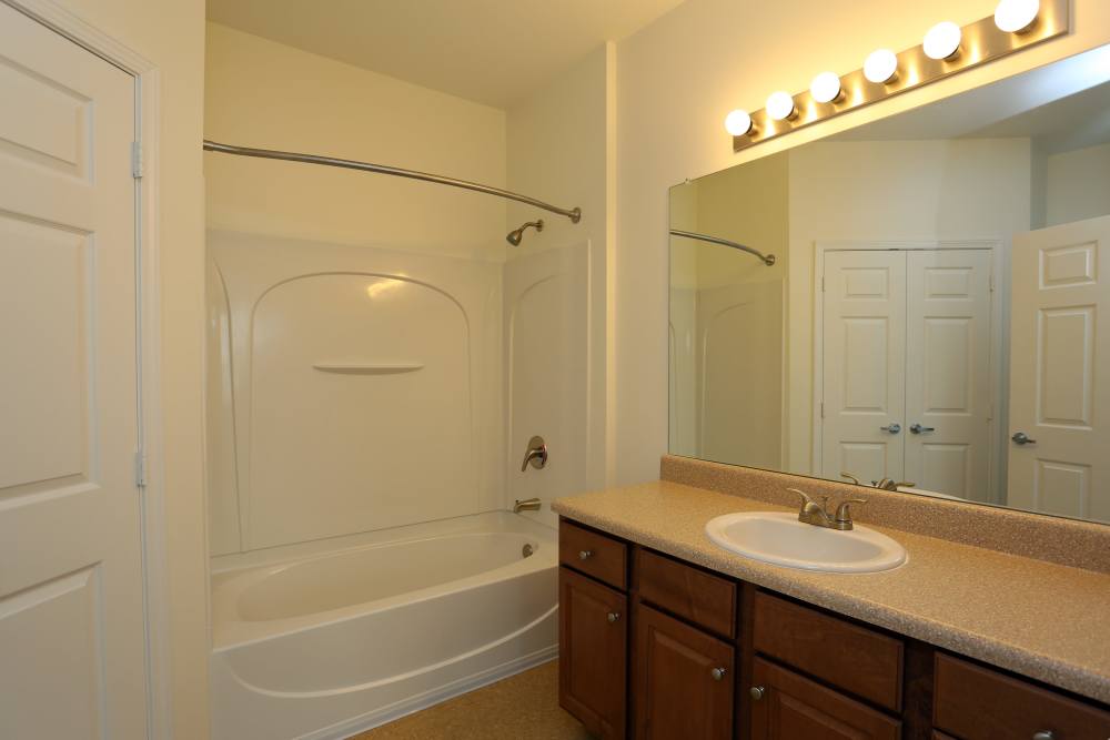 Bathroom with attached bath tub at Adams Crossing Apartment Homes in Waldorf, Maryland