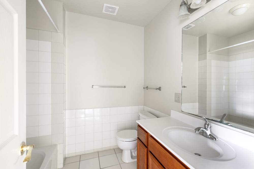 Bathroom with commode at Dundalk Village in Dundalk, Maryland