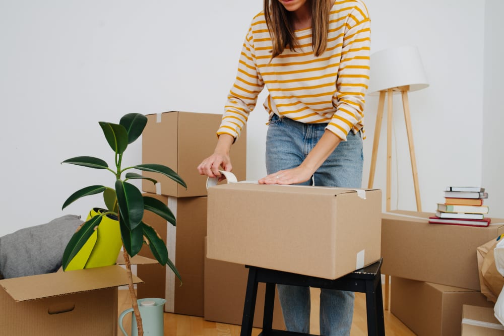 A customer packing boxes near Storage Star South College in Fort Collins, Colorado