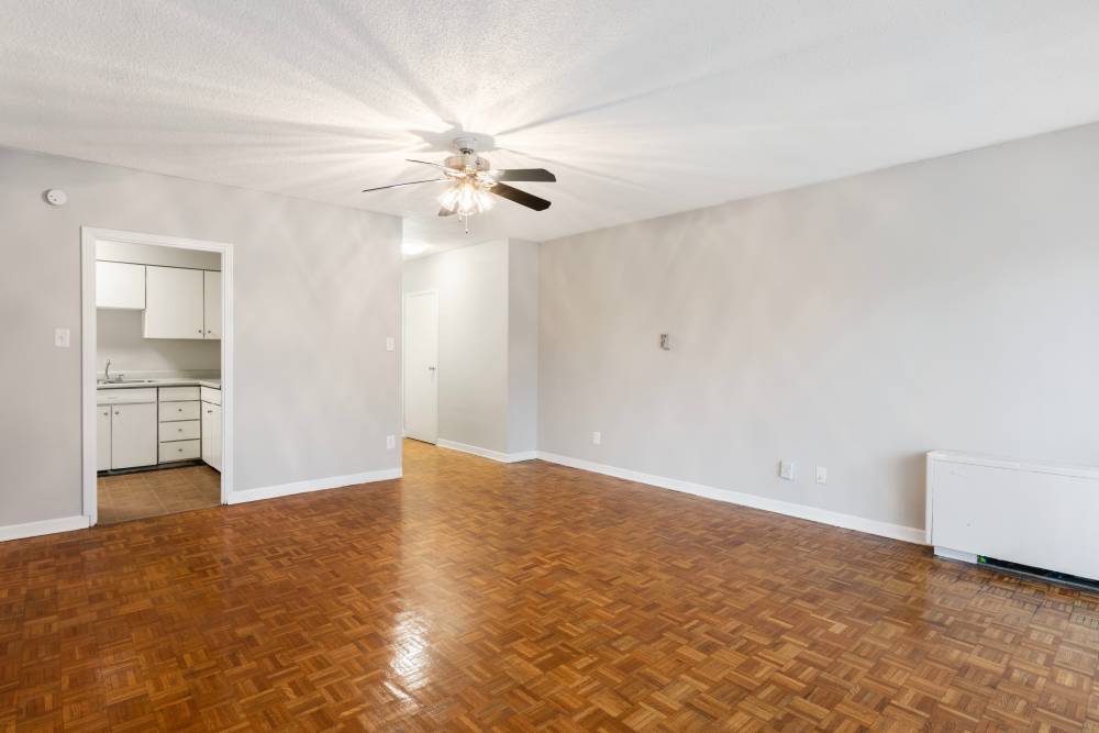 Living area with a ceiling fan and access to kitchen at Central Gardens in Memphis, Tennessee