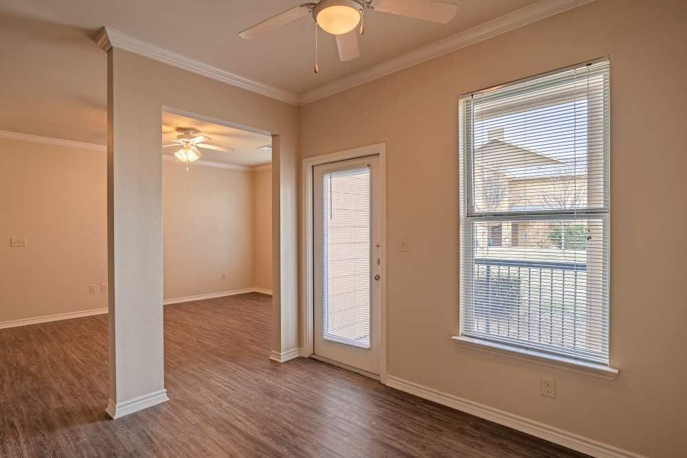 Apartment with hardwood plank flooring and crown molded ceilings at Blue Ridge in Midland, Texas