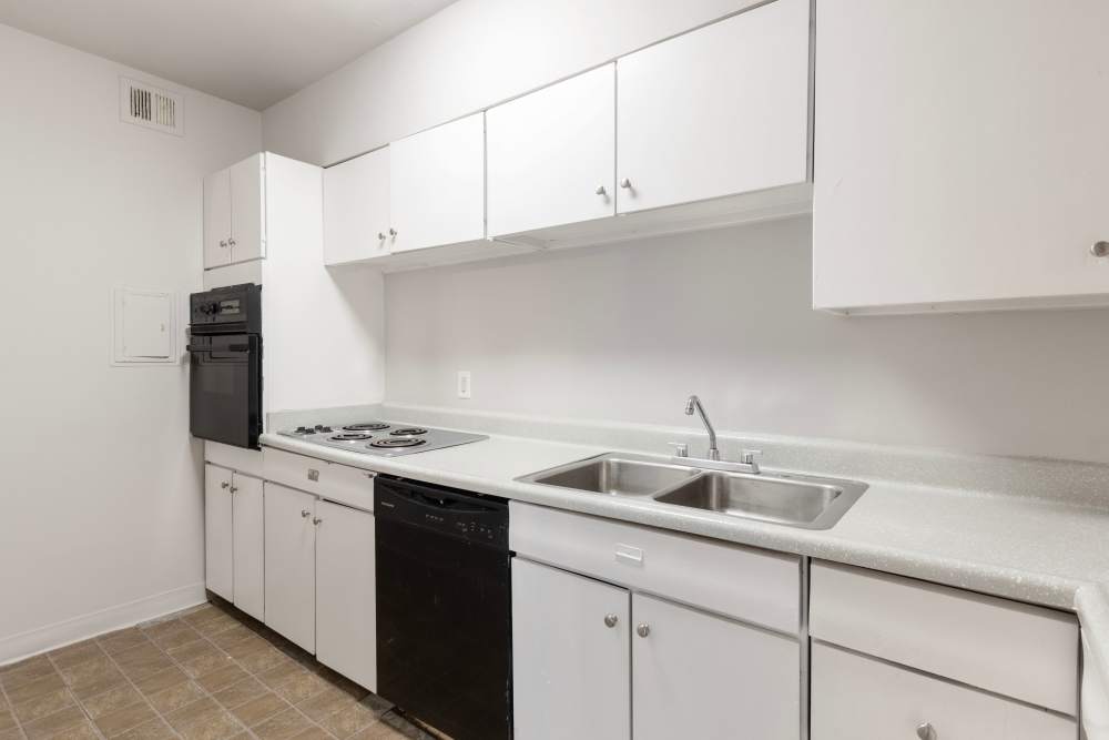 Charming modern kitchen with sleek appliances at Central Gardens in Memphis, Tennessee