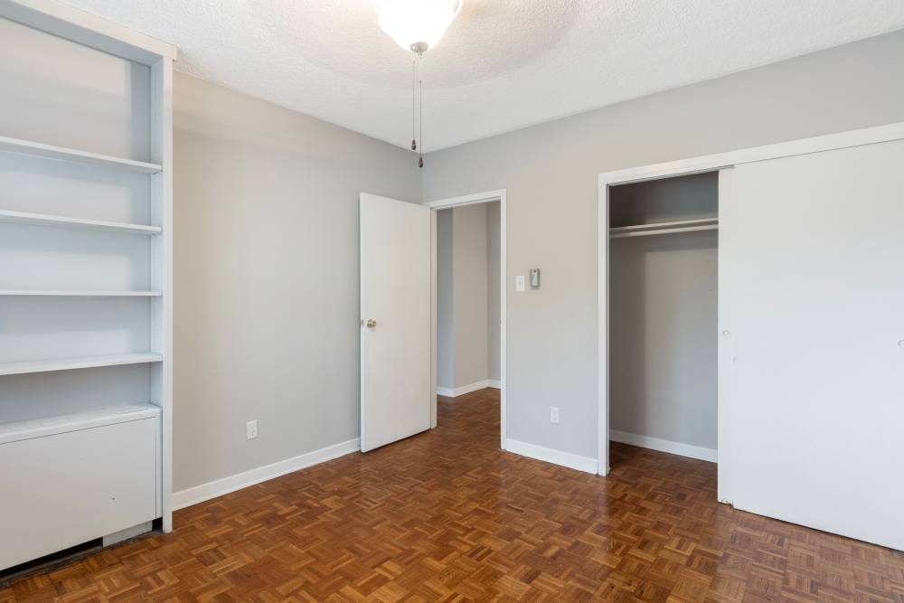Spacious bedroom with closet and shelves at Central Gardens in Memphis, Tennessee