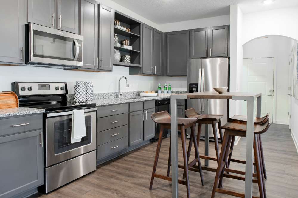  Kitchen with stainless steel appliances and island seating at Springfield Apartments in Murfreesboro, Tennessee
