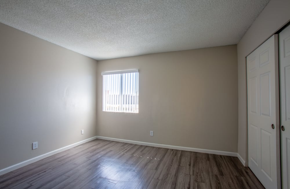 Bedroom with wood-style flooring at Montecito in Albuquerque, New Mexico