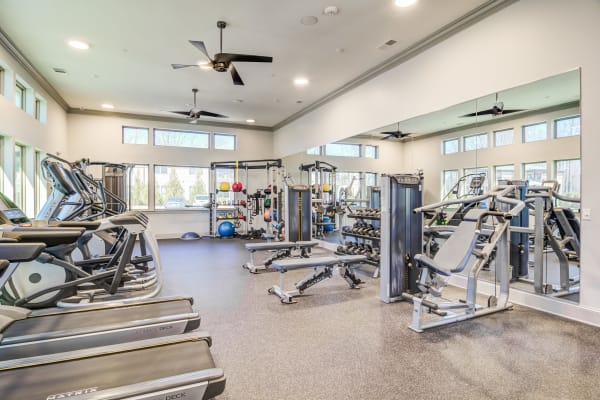 Treadmills facing the window in the fitness center at Brookside Heights Apartments in Cumming, Georgia