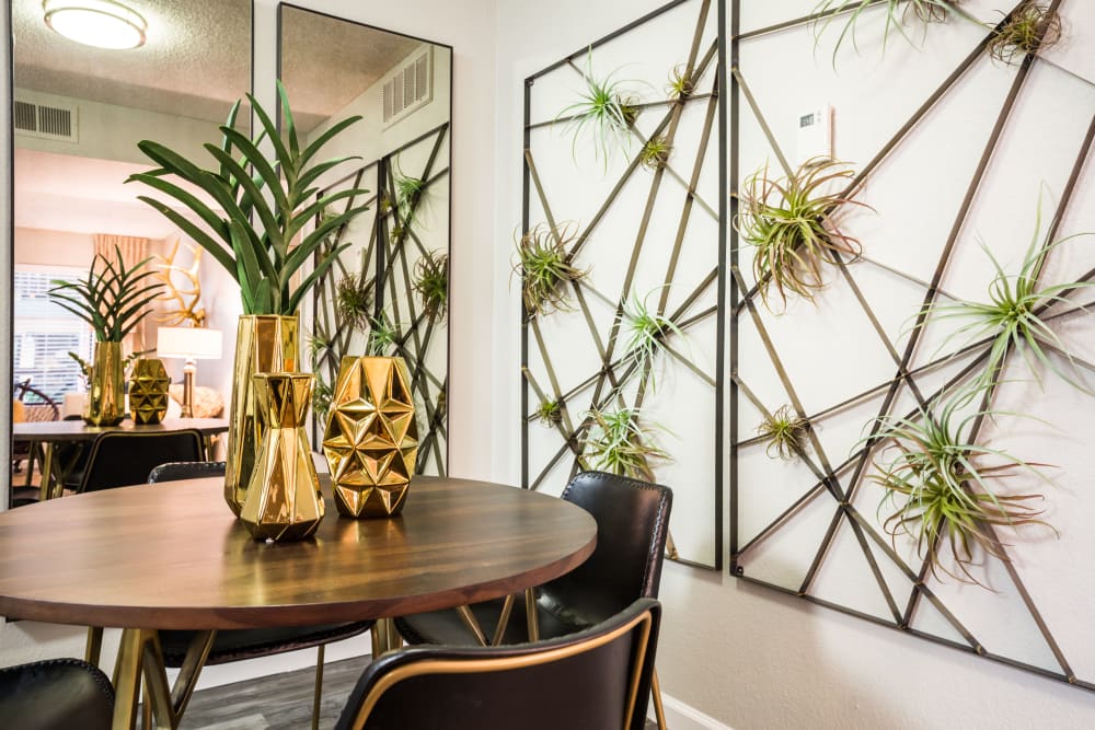 Dining room area with decorative wall art and centerpieces at 4127 Arcadia in Phoenix, Arizona