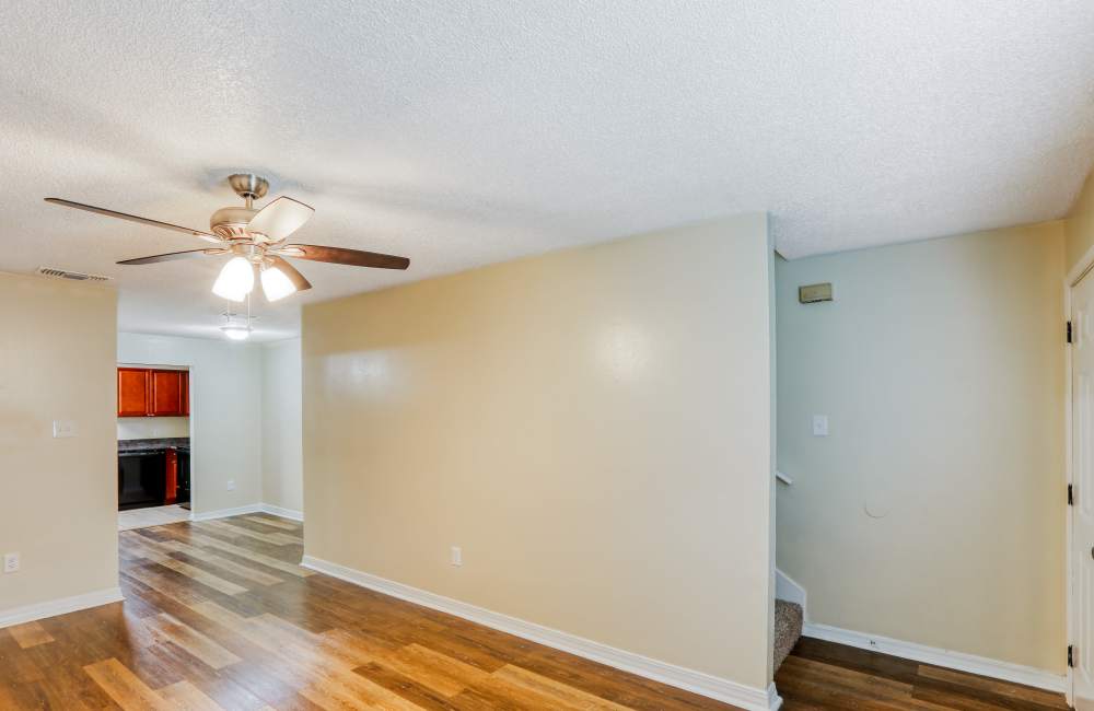 Apartment bedroom with ceiling fan at Creekwood Townhomes in Hammond, Louisiana