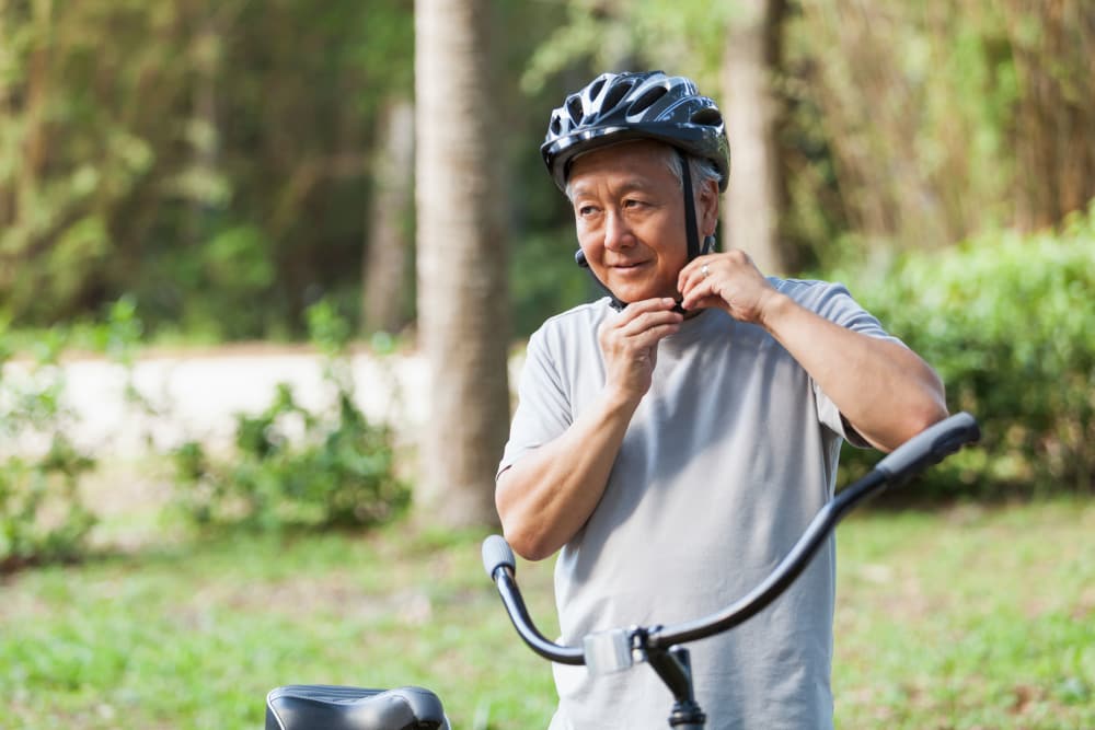 Man preparing to ride bike near Penn North Plaza in Baltimore, Maryland