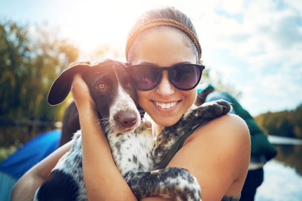 Woman out camping with her dog near Ridgeview Place in Irving, Texas