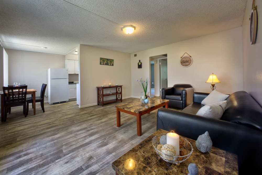 Living room with dining space at Fair Oaks Apartments in Sacramento,California