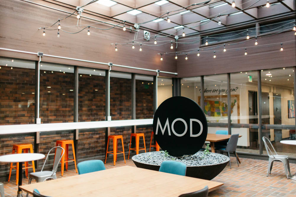Patio space with string lights at MOD Apartments in Seattle, Washington
