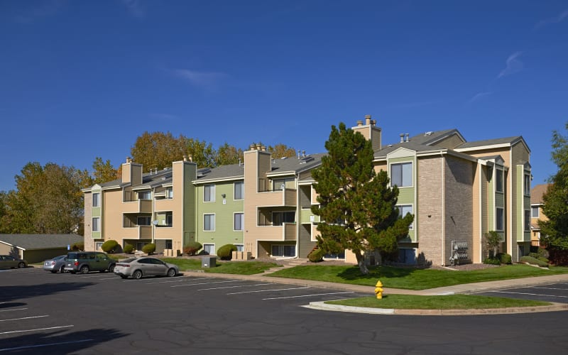 Green and tan exterior of Alton Green Apartments in Denver, Colorado
