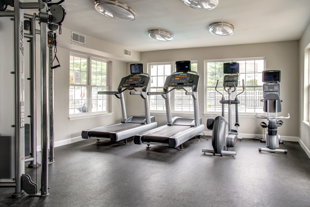 A modern community gym with treadmills at Greenway Chase in Florissant, Missouri