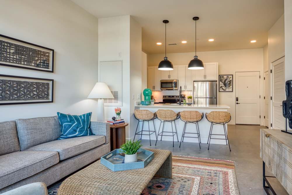Living room with connecting kitchen at Fusion at Neon in Norfolk, Virginia