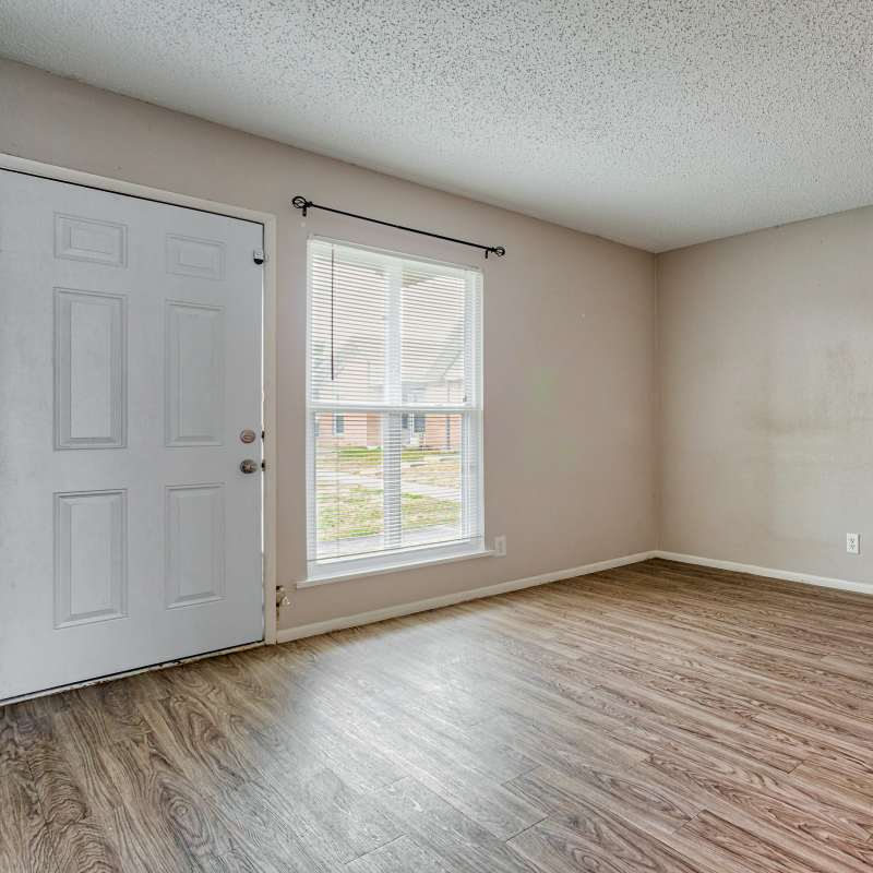 Bright living room with window at The Residence At Okemah in Okemah, Oklahoma