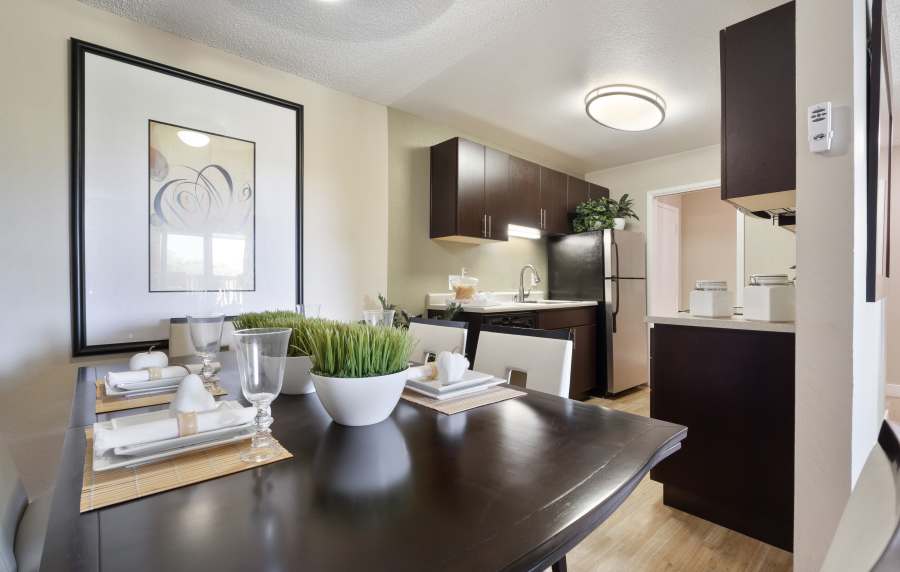 Elegant dining area with access to kitchen at Harbor Cove Apartments in Foster City, California