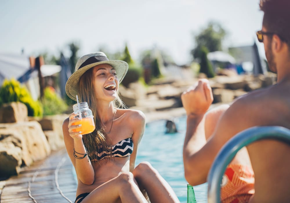 Residents enjoying some drinks at the pool at Sofi Belmont Hills in Belmont, California