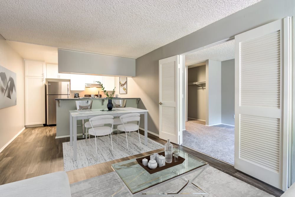 Dining room with wood-style flooring at Hillside Terrace Apartments in Lemon Grove, California