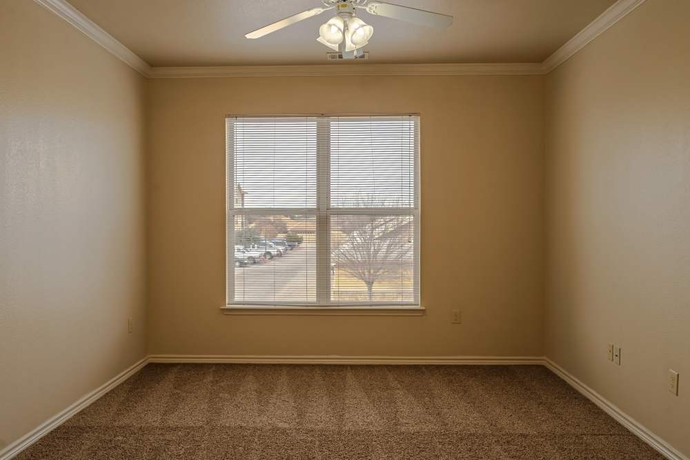 Carpet floored apartment bedroom with nine foot ceilings at Blue Ridge in Midland, Texas