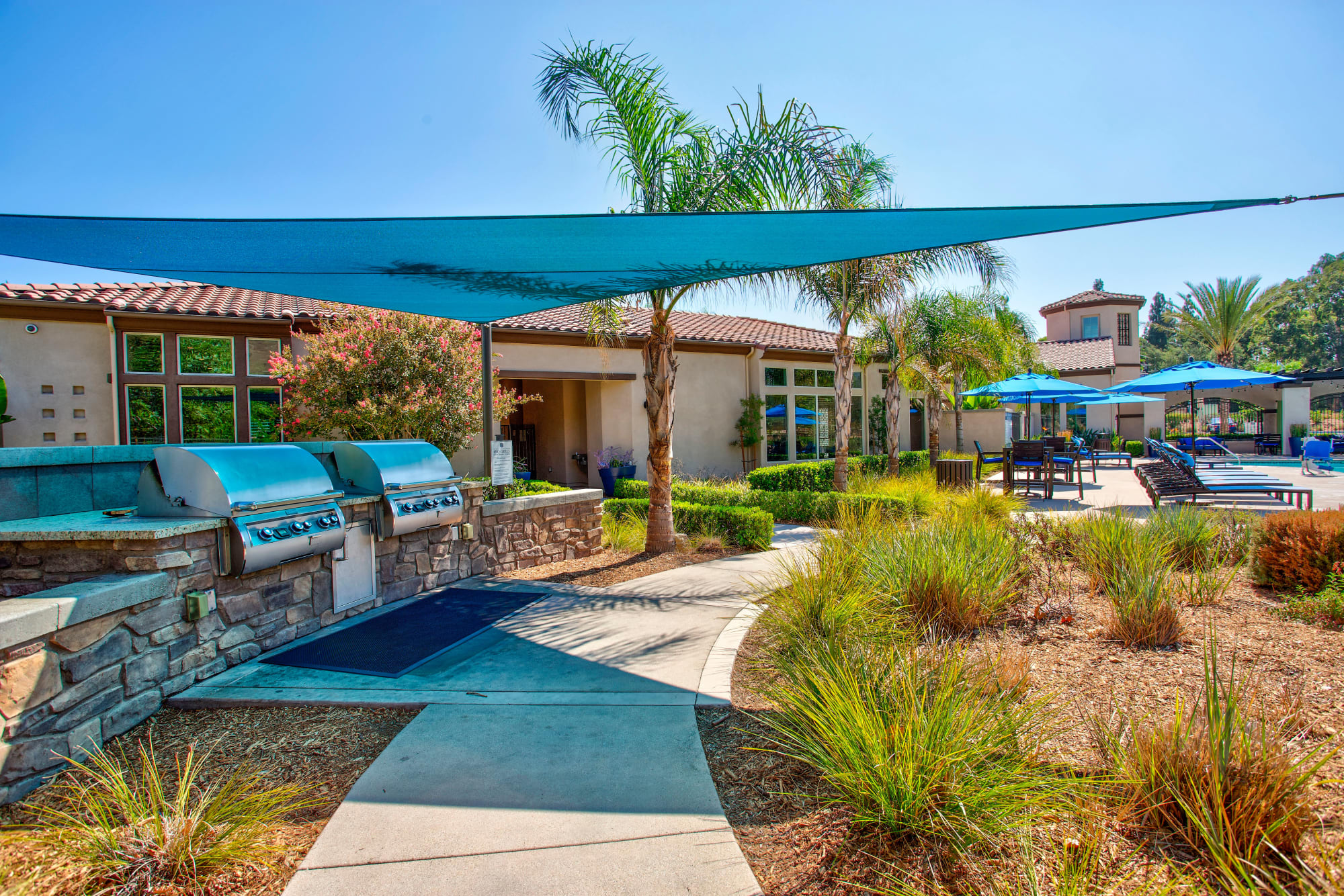 Shade sails over the barbeque area at Palisades Sierra Del Oro in Corona, California