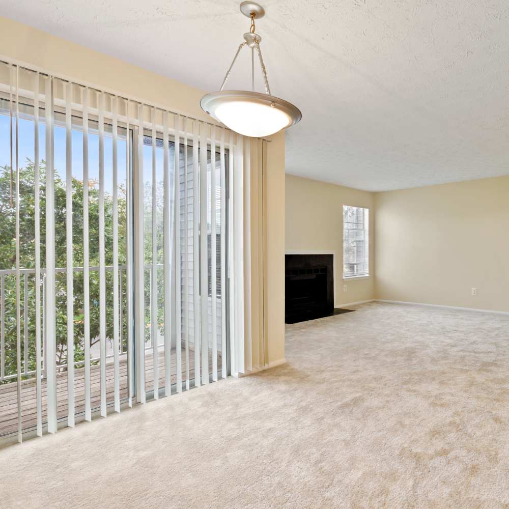 Living room with close access to patio at Chase Heritage in Sterling, Virginia