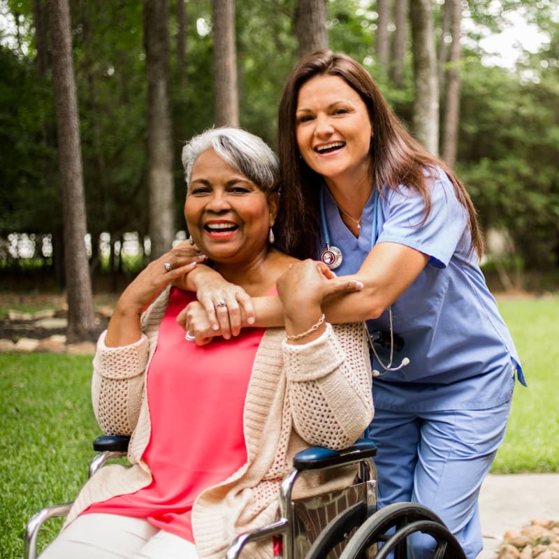 A resident on a walk with a team member at Aurora on France in Edina, Minnesota. 