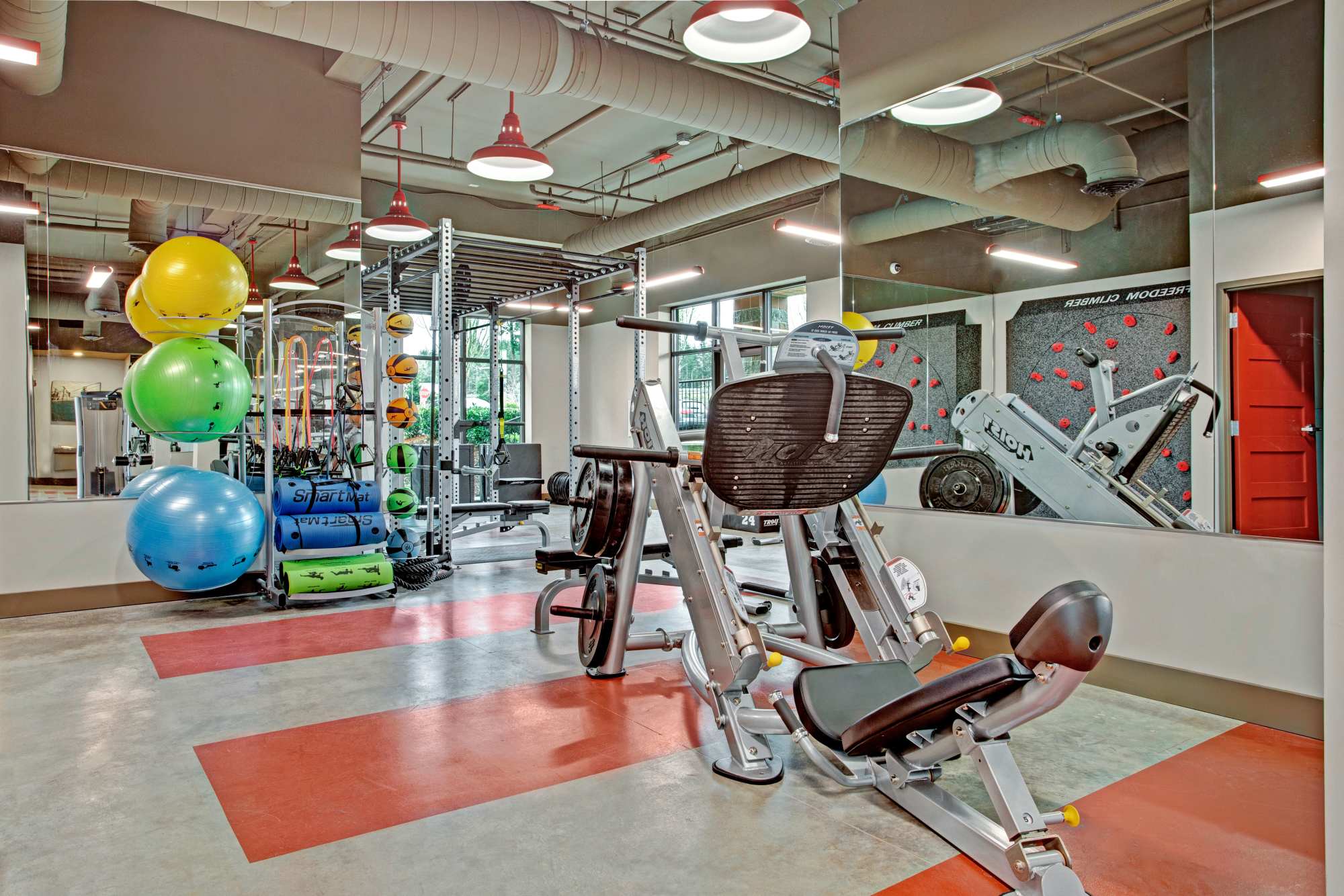 Fitness center with various equipment at Trax at Dupont Station in Dupont, Washington