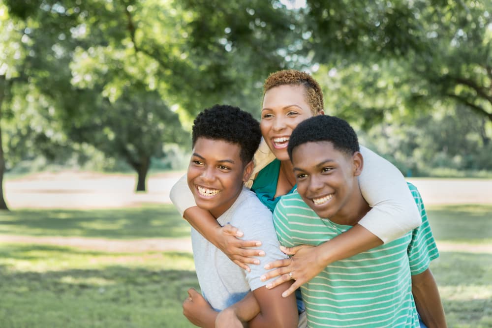 Teenagers enjoying the park near McKinnon Apartments in Sacramento, California