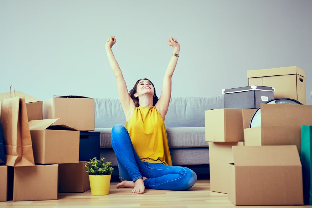 A woman celebrates her new apartment in San Diego, California