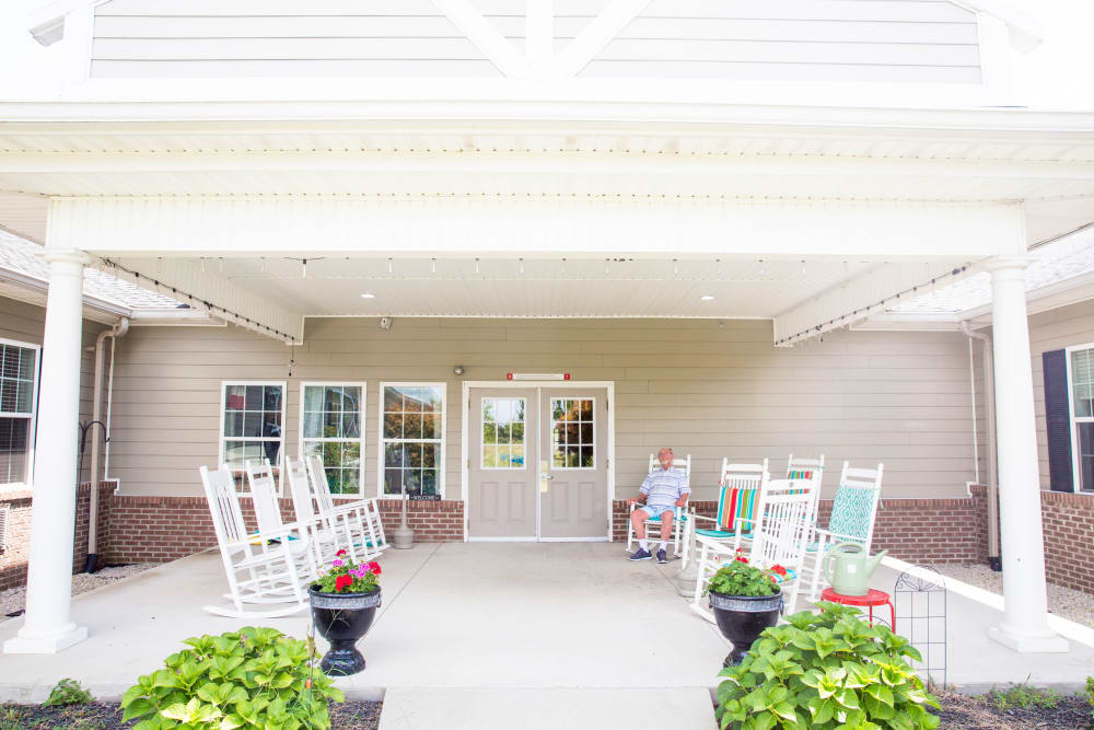 Rocking chairs on resident porch at Arcadian Cove in Richmond, Kentucky.