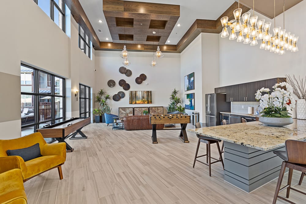 Modern and bright clubhouse interior at Olympus Hudson Oaks in Hudson Oaks, Texas